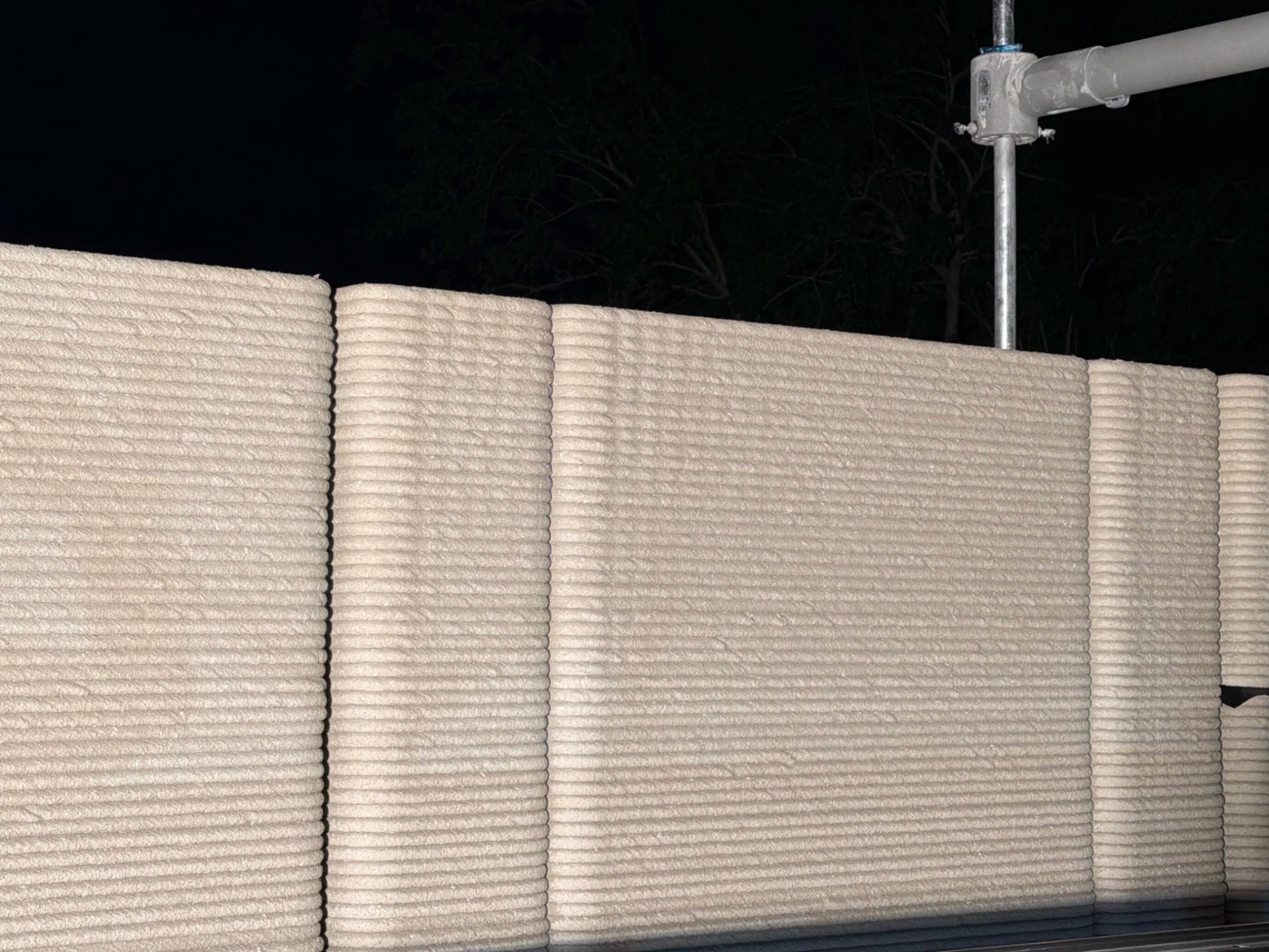 3D-printed concrete wall — additive manufacturing in progress