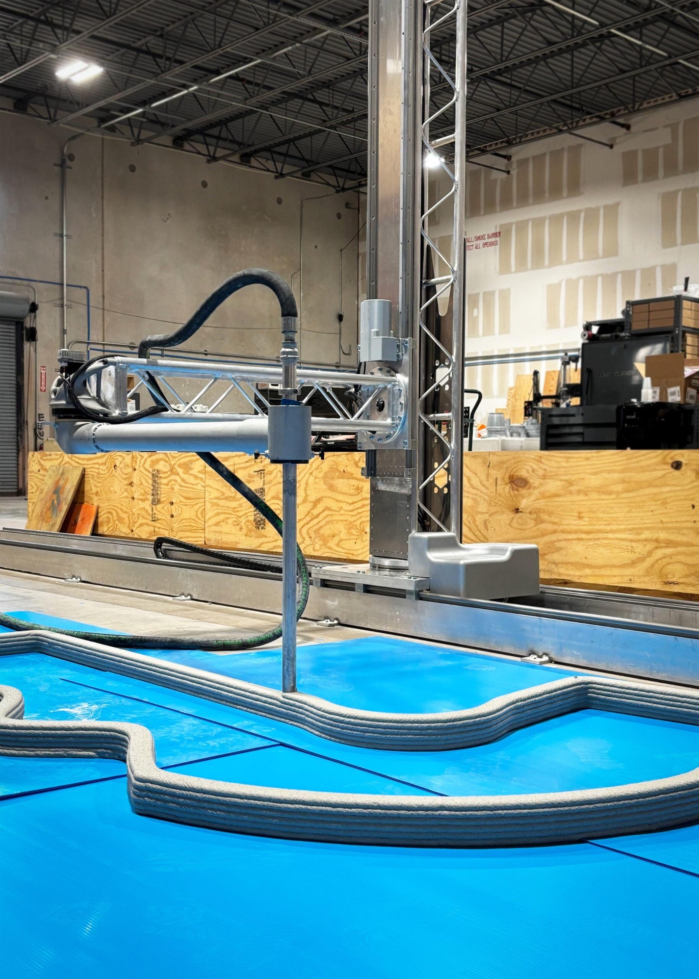ProBuild3D SCARA HD concrete printer depositing layers in a production facility